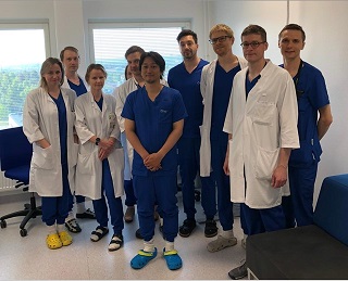 A group of medical doctors looking into the camera.